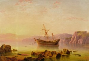 Et skip for anker i en bukt ved solnedgang
