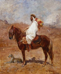En araber på en hest i et ørkenlandskap