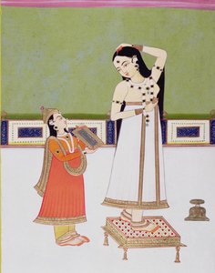 Indisk dame på toalettet hennes ser på seg selv i et speil (gouache og bladgull på papir) av Indian School