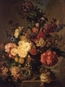Blomster på en avsats ved en foss av Jan van Os