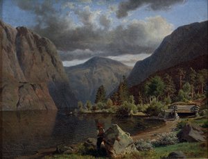 Mann i fjordlandskap