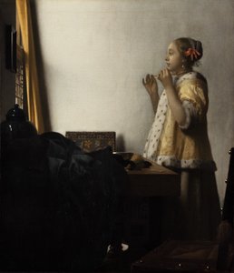 Ung dame med perlekjede av Johannes Vermeer