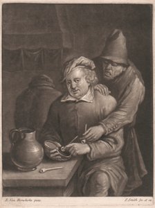 En røyker som sitter ved bordet