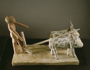 Begravelsesmodell av en plogmann som leder plogen sin tegnet av to okser (malt tre)