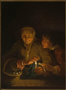 Gammel kvinne og gutt med et lys