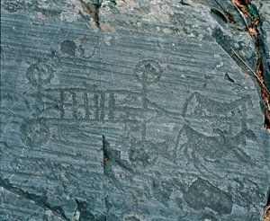 Forhistorie: Camunni sivilisasjon: en vogn avfyrt av hester, hjul er representert med eiker og hester er i profil i et forsøk på å prospektere. Berggravering av stein 23 av Naquane (Valcamonica, Val Camonica, Brescia). Periode mellom neolitikum og bro av Prehistoric Prehistoric