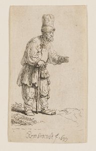 En bonde med høy lue, stående og lent mot en stokk av Rembrandt van Rijn