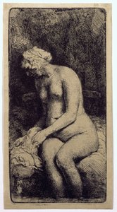 En kvinne som bader føttene ved en bekk av Rembrandt van Rijn