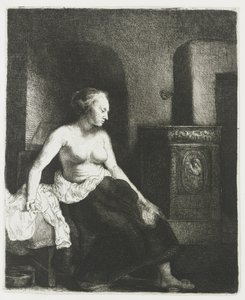 Kvinne som sitter halvkledd ved siden av en komfyr av Rembrandt van Rijn