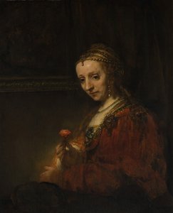 Kvinne med en rosa, tidlig på 1660-tallet. av Rembrandt van Rijn