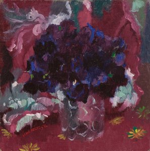 Blå stemorsblomster i et glass