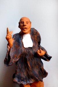 Advokat i kjole, bønn, 1900-tallet (skulptur) av Robert Bousquet