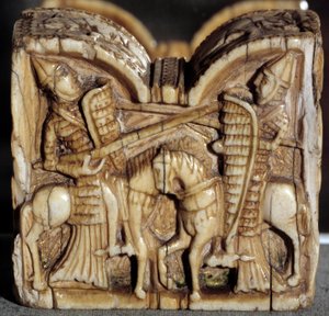 Romansk kunst: brikkebonde som representerer en kamp mellom to riddere. Elfenbensskulptur. Fra Spania. Dim. 0,64x0,68 m. Paris, Louvre-museet av School Spanish