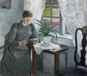 Interiør med kvinne som leser