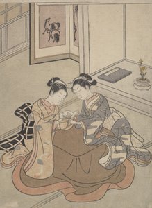 To unge kvinner sitter ved en Kotatsu lekende katteholder, ca. 1765., ca. 1765. av Suzuki Harunobu