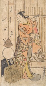 Skuespiller som kvinne som står ved et speilstativ, ca. 1735.