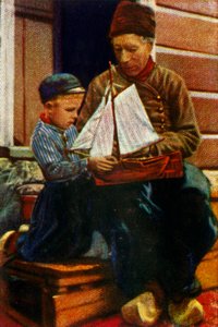 Nederlandsk far og sønn i tradisjonell kjole, c1928. av Unbekannt