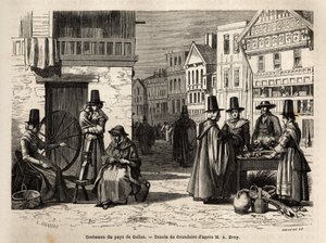 En gate i Wales, med lokalbefolkningen kledd i tradisjonelle kostymer, og dagligdagse aktiviteter: en førstehåndsfamilie og kvinner som spinner ull med hjul. Engravure pour illustrrer un voyage dans le pays de Wales, en 1862, av Alfred Erny, i "Le tour du  av Unknown artist