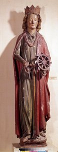 Representasjon av den hellige Katarina av Alexandria, som holder hjulinstrumentet for hennes pine. Polykrom trestatue av Unknown artist