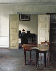 Et interiør med en kvinne som spiller piano, 1910
