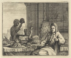 Mann ved et dekket bord