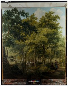 Bønder med en vogn nær bredden av en elv i en skogscene av Willem Uppink