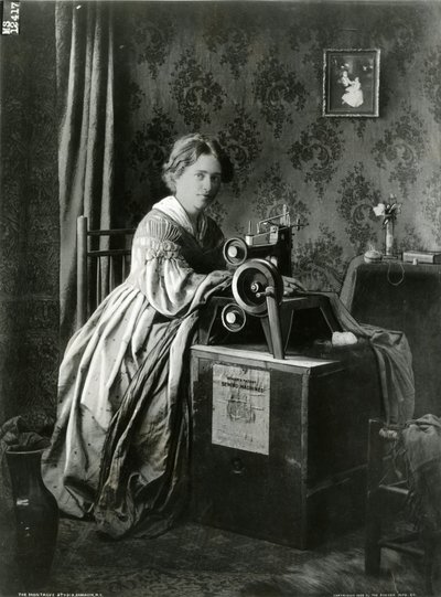 Annonse for Singers patentsymaskiner, 1899 av American Photographer