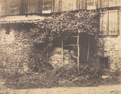 [Rustikk bygning med mann under espalier], ca. 1853. av André Giroux