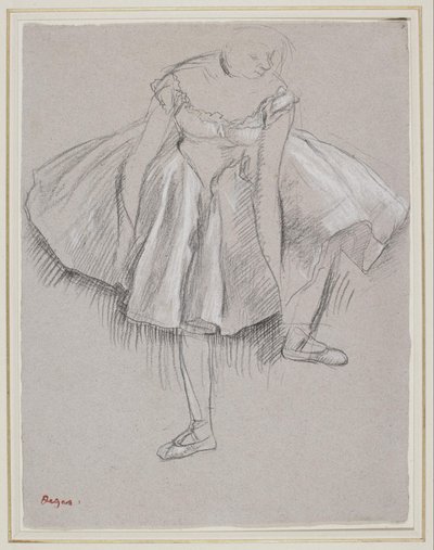 Danser som justerte tøffelen av Edgar Degas