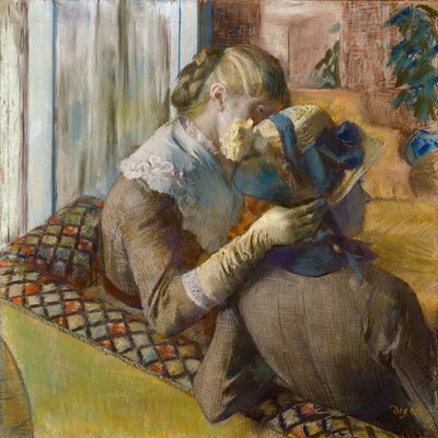 Hos moteisten. En klient prøver en lue av Edgar Degas