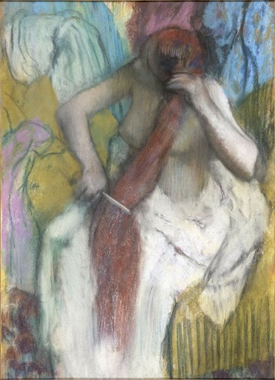 Kvinne som kjemmer håret av Edgar Degas