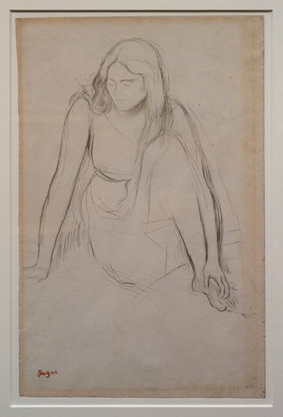 Kvinne sitter ved vannkanten. Rundt 1867-1868. Svart blyant på velinpapir. av Edgar Degas