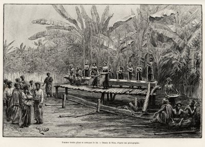 Batak-kvinner, etnisk gruppe i Nord-Sumatra, banker og renser ris. Gravering av Riou for å illustrere historien "et år i Malaysia", av Jules Claine (1856-1939) av Edouard Riou
