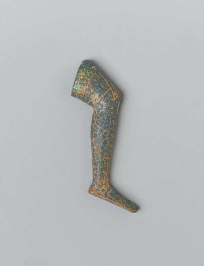 Lite blågrønt ugjennomsiktig glass menneskebein fra en innleggsfigur (glass) av Egyptian