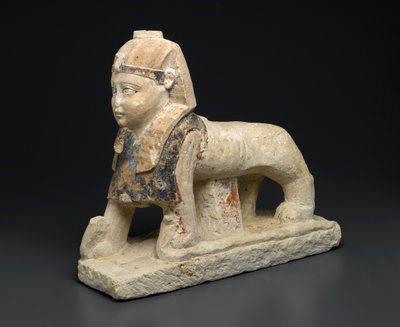 Guden Tutu som en sfinks som tråkker på slanger (kalkstein) av Egyptian