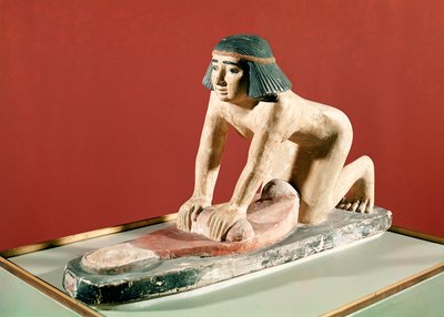 Modell av en kvinne som maler korn, Old Kingdom (polykrom stein) av Egyptian 5th Dynasty