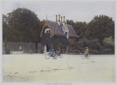 Syklister som sykler forbi Porte de Madrid i Bois de Boulogne, Paris (fargebilde) av French Photographer