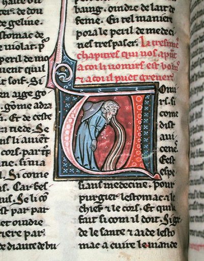 Historikert initial som viser en mann som kaster opp (vellum) av French School