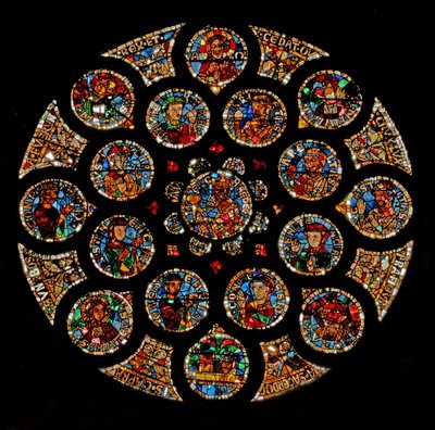 Vindu w108 som viser den nye pakt: øverst er Kristus (Alfa og Omega), deretter de fire symbolene på evangelistene som danner en firkant, to dyder er på venstre og høyre ekstremitet, og Ar av French School