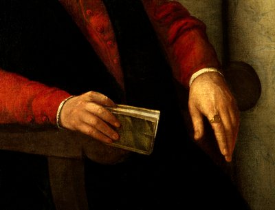 Antatt portrett av Francois Rabelais (1494-1553), fransk forfatter og lege. Detalj av boken han holder i hånden og av ridderen han bærer på fingeren. Maleri av Giovanni Battista Moroni (1525-1578) av Giovanni Battista Moroni