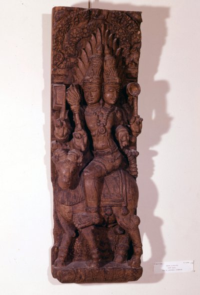 Agni, ildguden, avbildet med to hoder (bicephal) på en vær, ifølge hinduistisk mytologi. Treskulptur fra 1600-tallet. Paris, Musée Guimet. av Indian School