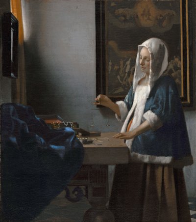 kvinne som holder en balanse av Johannes Vermeer