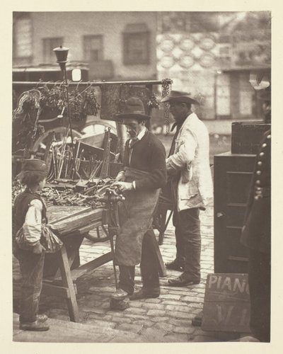 Gatelåsesmeden av John Thomson