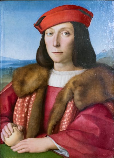 Porträt eines jungen Mannes mit einem Apfel, möglicherweise Francesco Maria della Rovere, um 1505 von Raphael (1483-1520)