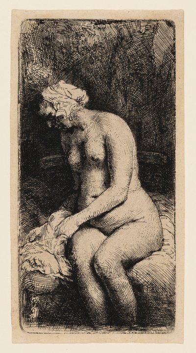 Kvinne som bader føttene ved en bekk av Rembrandt van Rijn