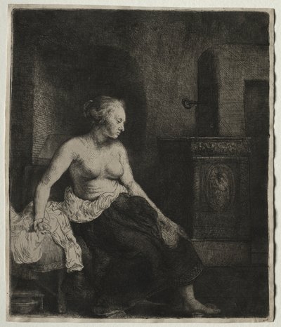 Kvinne som sitter halvkledd ved siden av en komfyr av Rembrandt van Rijn