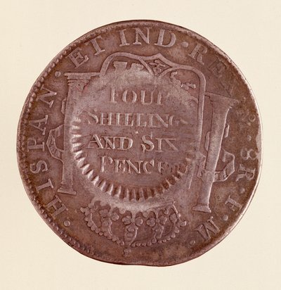 Sølvmynt (8 realer) fra Spania: Karl IIIs regjeringstid (1759-1788). 1777 med motmerke av 1787. Diam. 3,9 cm Napoli, museo archeologico av Spanish School