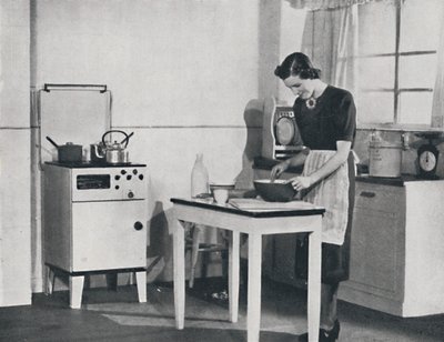 Et britisk kjøkken utstyrt med en skapgasskomfyr, 1942. av Unbekannt