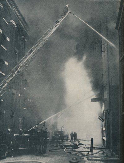 Massed Forces of the Modern Fire-Fighter Pitted Against a City Blaze, c1935 av Unbekannt