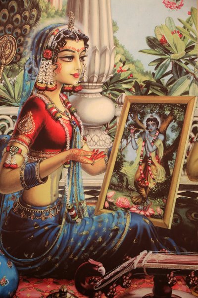 Maleri som viser Radha som ser på et bilde av Krishna. India av Unbekannt
